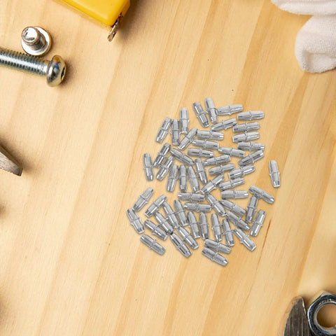 100 Pack Straight Up Sturdy Shelf Pegs For Wood Shelving Heavy Duty Metal Support Pins with smooth silver edges on wood surface.