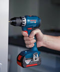 Badass 18V Cordless Drill Driver With Brushless Motor And Smooth Shifting Dual Speed For Tearing Through Tasks Without A Sweat Light Workhorse Power Tool With Grippy Keyless Chuck held in hand, drilling into a surface.