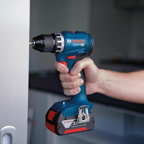 Badass 18V Cordless Drill Driver With Brushless Motor And Smooth Shifting Dual Speed For Tearing Through Tasks Without A Sweat Light Workhorse Power Tool With Grippy Keyless Chuck held in hand, drilling into a surface.
