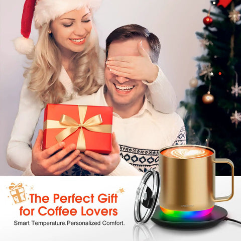 Smart Self Heating Coffee Mug With 12 Oz Capacity And Ai Auto Warm Tech Features Music Reactive Ambient Lights next to a gift.