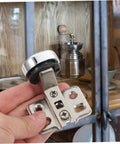 Hand holding Two Pack Soft Close Cabinet Hinges With Hydraulic Damping For Frameless Cabinets Self Closing Mechanism For Kitchen Doors DIY