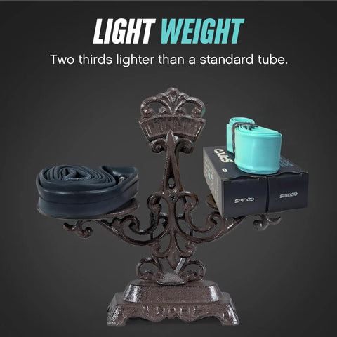Scale with 2 Pack Lightweight 29 Inch TPU Inner Tubes For Mountain Bikes 2.2 To 2.5 With 48mm Presta Valves, tubes on one side.
