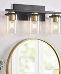 3-Light Black And Gold Bathroom Vanity Lights With Glass Cylinder Sconces For Wall Mounted Bathroom Lighting above mirror