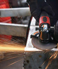 Straight From The Shop Floor Heavy Duty 4.5 Inch Air Angle Grinder cutting metal with sparks flying.