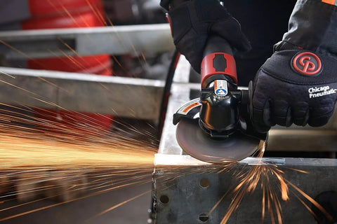 Straight From The Shop Floor Heavy Duty 4.5 Inch Air Angle Grinder cutting metal with sparks flying.