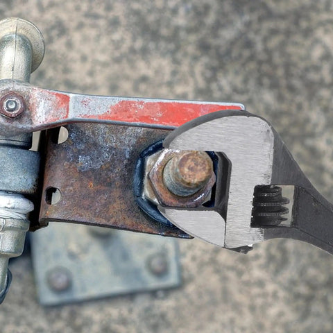 Two Pack 2.5 Inch Mini Adjustable Crescent Wrenches With Locking Keychain in use on a rusted bolt, compact carbon steel tool.