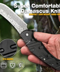 Close-up of hand holding Beefy 67 Layer Damascus Steel Folding Pocket Knife with VG10 core and G10 handle.