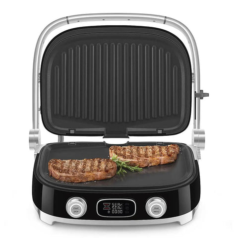 SMEG MGF01 Retro Countertop Electric Grill and Panini Press With Swappable Plates For Waffles, Burgers, And Steak showcasing grilling steaks.