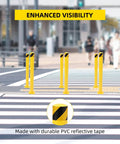 Heavy Duty 4 Pack Safety Bollards 36 Inch Height 4.5 Inch Steel Pipe Posts With Anchor Bolts Rock Solid Yellow Parking Poles positioned on a crosswalk.