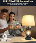 Couple using Farmhouse Table Lamps Set of 2, 3 Way Dimmable Touch Lamps with USB Port, charging devices on nightstand.