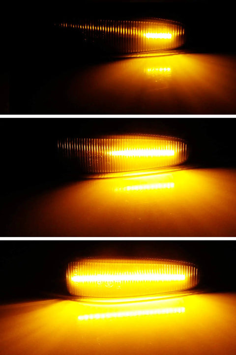 Smoked Amber LED Side Marker Light Assembly Pair With 36 SMD LEDs Sequential Blink Black Smoke Lens illuminated in darkness.