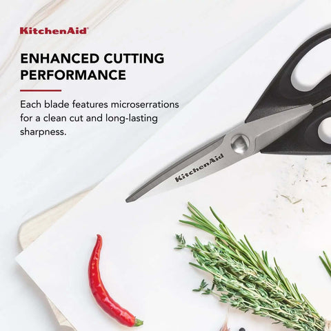 All Purpose Kitchen Shears with Protective Sheath, Rust Resistant Stainless Steel Blades, Micro Serrated Edges, Soft Grip Comfort Handle shown cutting herbs