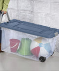 Slick Rolling 2 Pack 160 Quart Heavy Duty Storage Totes With Oversized Swivel Casters And Lockdown Pull Handle Extra Large Wheeled Plastic Bins Drip Resistant Double Latch Systems Garage Ready, shown carrying toys.