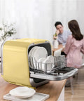 Portable Countertop Dishwasher Featuring No Fuss Quick Wash Cycles And Smart Energy Savers with clean plates in a yellow shell.