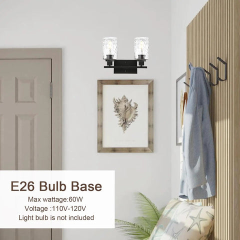 Room interior with Two Light Matte Black Wall Sconce with Clear Hammered Glass above framed picture, next to wooden panel.