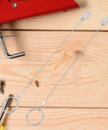 Stainless Steel Quick Release Safety Pins With 240mm Coil Lanyard, Marine Tether Kit for Boats and Trailers on wooden surface