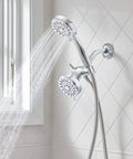 Ignite Dual Shower Head Kit with handheld and fixed 3.75 inch heads, chrome, installed in a tiled bathroom with water flow