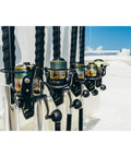 Row of Battle III Inshore Spinning Reels with HT-100 Front Drag, 12 lb max drag, all aluminum construction, black gold finish, saltwater ready