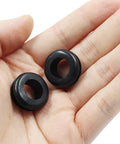 Close-up of two 30 Pieces Rubber Grommets One Half Inch ID With Nine Sixteenths Inch Drill Hole Durable Wiring Grommets Set in hand