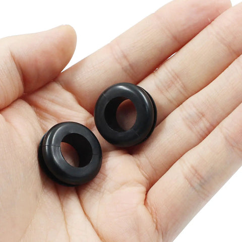 Close-up of two 30 Pieces Rubber Grommets One Half Inch ID With Nine Sixteenths Inch Drill Hole Durable Wiring Grommets Set in hand