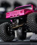 Black Brass Steering Links 14G Upgrade For 1/24 Scale RC Axial SCX24, CNC Machined, Heavyweight Performance, Built To Boost Stability, Easy Direct Replacement, Durable Steering Upgrade For Tough Trails And Precise Handling. RC crawler steering links under pink truck