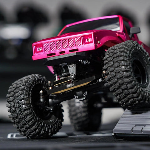 Black Brass Steering Links 14G Upgrade For 1/24 Scale RC Axial SCX24, CNC Machined, Heavyweight Performance, Built To Boost Stability, Easy Direct Replacement, Durable Steering Upgrade For Tough Trails And Precise Handling. RC crawler steering links under pink truck