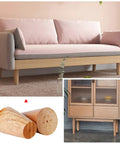Top Shelf Solid Wood Replacement Desk Legs Set Of 4, heavy duty hardwood riser foot blocks supporting a modern sofa.