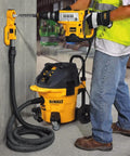 Worker using Heavy Duty Hammer Drill Dust Extraction System With Two Interchangeable Heads for masonry drilling