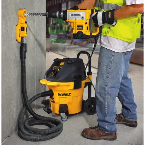 Worker using Heavy Duty Hammer Drill Dust Extraction System With Two Interchangeable Heads for masonry drilling