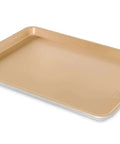 Nonstick Aluminum Half Sheet Pan 13 By 18 Inches With Reinforced Steel Rim for even baking, shown at an angle.