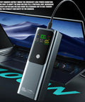 Built Tough 21700 Battery Vault With Four Slot Fast Charge Hub featuring rugged ABS housing charging on a laptop.