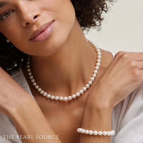 Woman wearing Must Have 14K Gold Akoya Pearl Necklace Bracelet Earrings Set With 18 Inch Princess Length For Women 7.5 To 8mm Round White Cultured Pearls High Luster Classic Elegant Jewelry Trio
