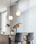 Mid Century Modern Large Globe Pendant Light With Brushed Brass Finish And White Glass Sphere in kitchen, 13.8 Inch