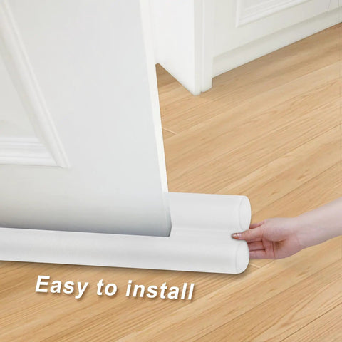 Slick Under Door Draft Stopper White Weather Seal showing easy installation under a door on hardwood floor.