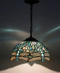 Sea Blue Stained Glass Dragonfly Tiffany Pendant Light Fixture with 12 Inch Shade and 24 Inch Chain, glowing with patterns.