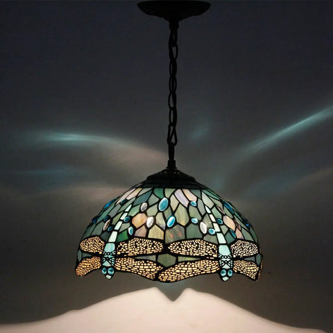 Sea Blue Stained Glass Dragonfly Tiffany Pendant Light Fixture with 12 Inch Shade and 24 Inch Chain, glowing with patterns.