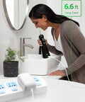 Woman using Plug And Play Cordless Water Flosser Charger For WP Series Replacements Arkare 3V Wall Power Supply in bathroom