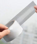 Polyurethane Screen Repair Tape With Fine Mesh Patch being held, showing black durable adhesive and fine mesh for window and door screens.