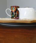 White teapot on a tray atop Beefy 12 Inch Lazy Susan Bearing With 1000 Lb Load Capacity Metal Frame Ball Bearing Raceway For Smooth Rotation Zinc Coated To Resist Corrosion Mounting Screws Not Included.
