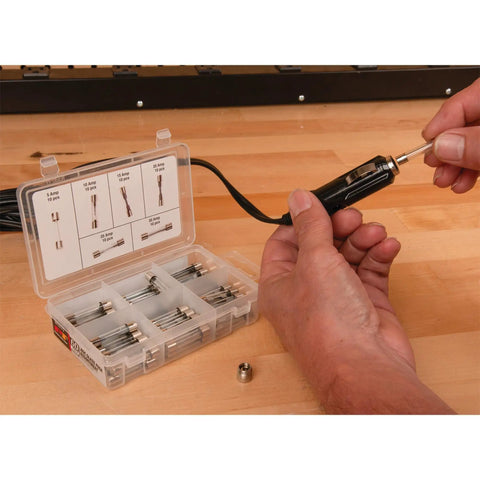 Heavy Duty Sixty Piece AGC Glass Fuse Assortment Kit With Solid Circuit Protection For Cars Trucks And Hot Rods, shown being used.