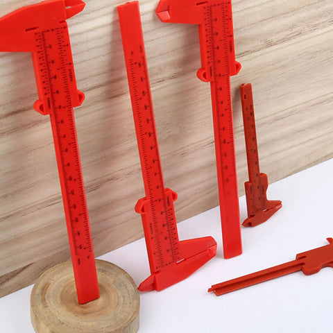 Depth Vernier Caliper 3inches, 6inches Depth Vernier measuring tool in red plastic on wooden surface.