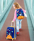 Child with Two Piece Kids Luggage Set With 12 Inch Backpack And 18 Inch Rolling Suitcase In Blue Astronaut Design on walkway