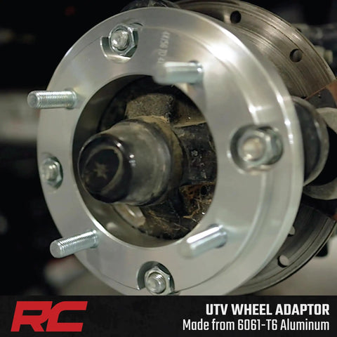 Close-up of heavy duty UTV wheel adapter made from 6061-T6 aluminum, part of upgrade for Polaris UTV setup with 4x156 to 4x136 pattern.