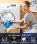 Woman loading washing machine in bright laundry room with easy care instructions displayed