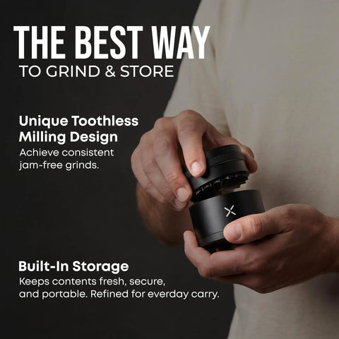 Hand holding Toothless 2.5 Inch Aluminum Spice And Herb Grinder with extra storage compartment in matte black.