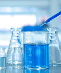 One Milliliter 29 Gauge Lab Syringe With Cap 13 Millimeter U100 Disposable Medical Syringe Pack Of 20 For Precise Lab Work And Home Science Projects That Stand Up To Quick Access And Reliable Dosing. Blue liquid in glass lab beakers