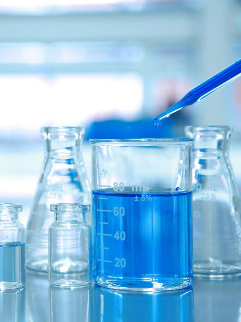 One Milliliter 29 Gauge Lab Syringe With Cap 13 Millimeter U100 Disposable Medical Syringe Pack Of 20 For Precise Lab Work And Home Science Projects That Stand Up To Quick Access And Reliable Dosing. Blue liquid in glass lab beakers