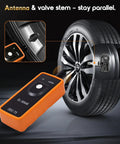 No Hassle Tpms Relearn Tool For Gm Cars El 50448 activating tire pressure sensor on a shiny alloy wheel.