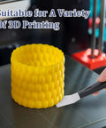 Person using Stainless Steel 3D Printer Scraper Tool with Large Head for resin removal on yellow 3D printed model in printer