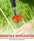 Rock Solid Heavy Duty Metal Tent Stakes Set With 7.87 Inch Screw In Pegs And Plastic Rotating Heads In Bright Orange being drilled into grass